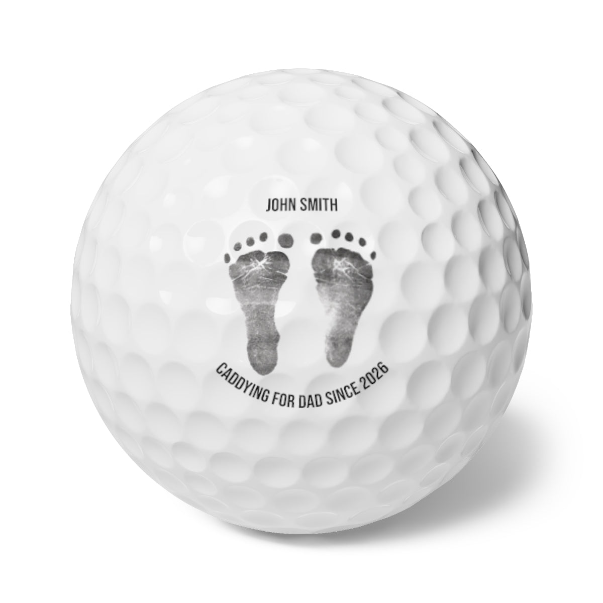 Custom golf ball keepsake with baby's footprint on it.