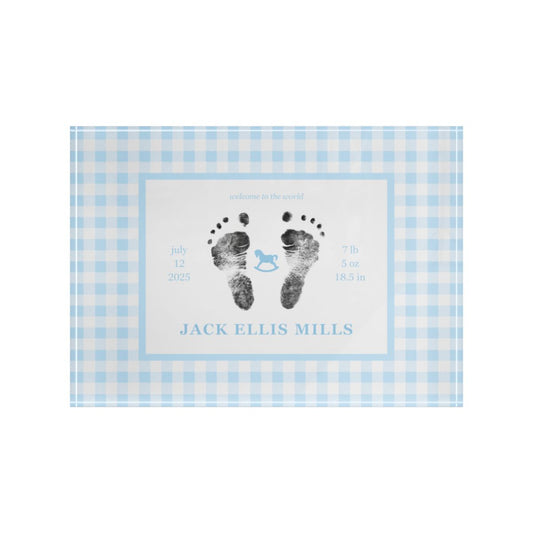 Blue acrylic block with baby footprints and text.