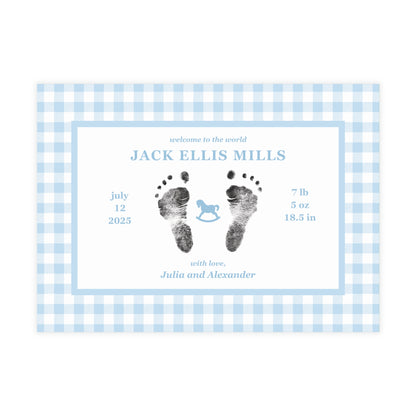 Baby birth announcement card with blue gingham border and footprints on a white background