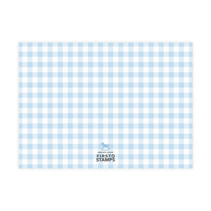 Blue and white checkered paper with 'First Stamps' logo at the bottom right corner on a white background.