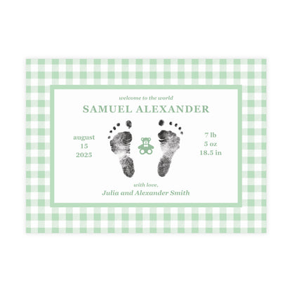 Baby birth announcement card with green gingham border and footprints on a white background