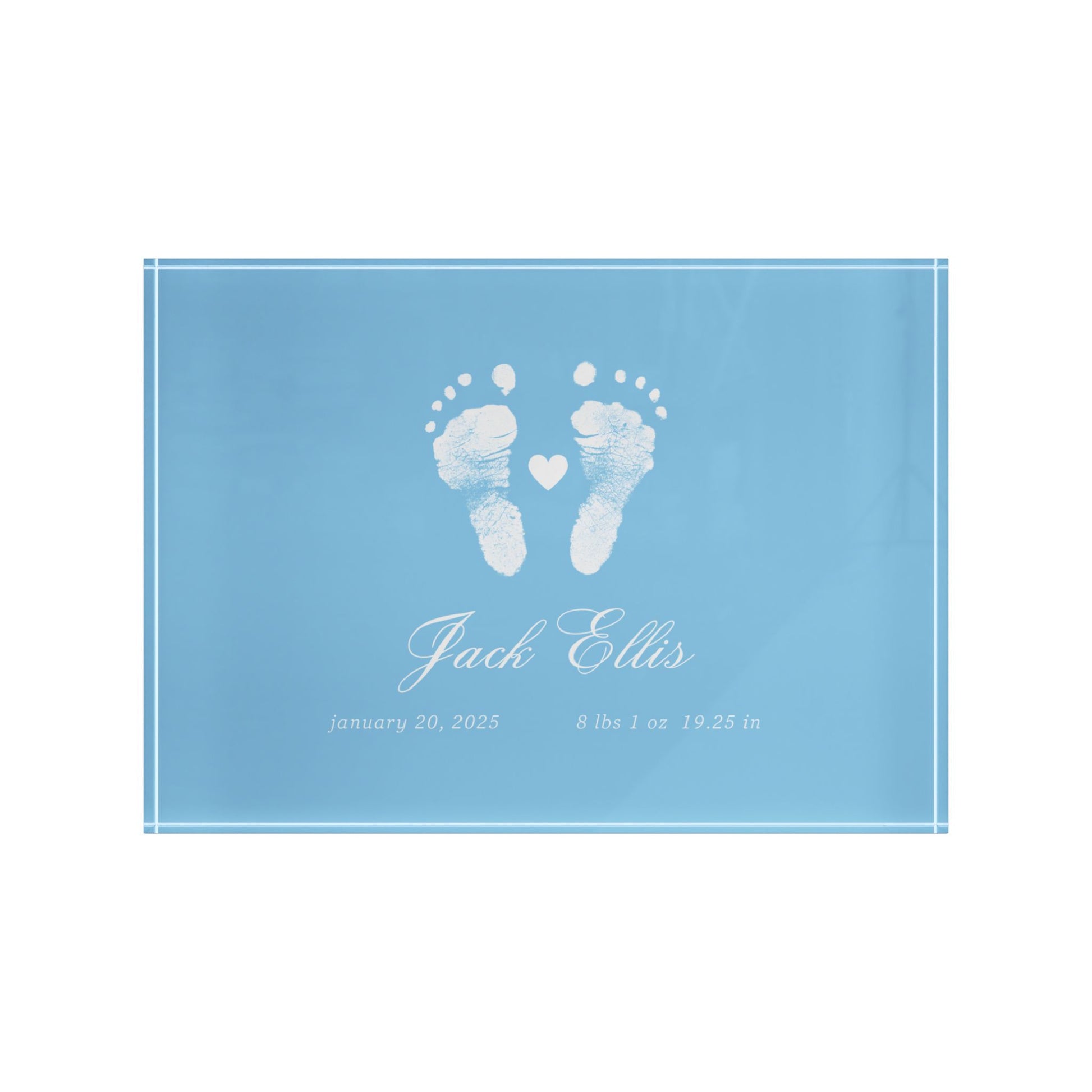 Blue acrylic block with white baby footprints and text