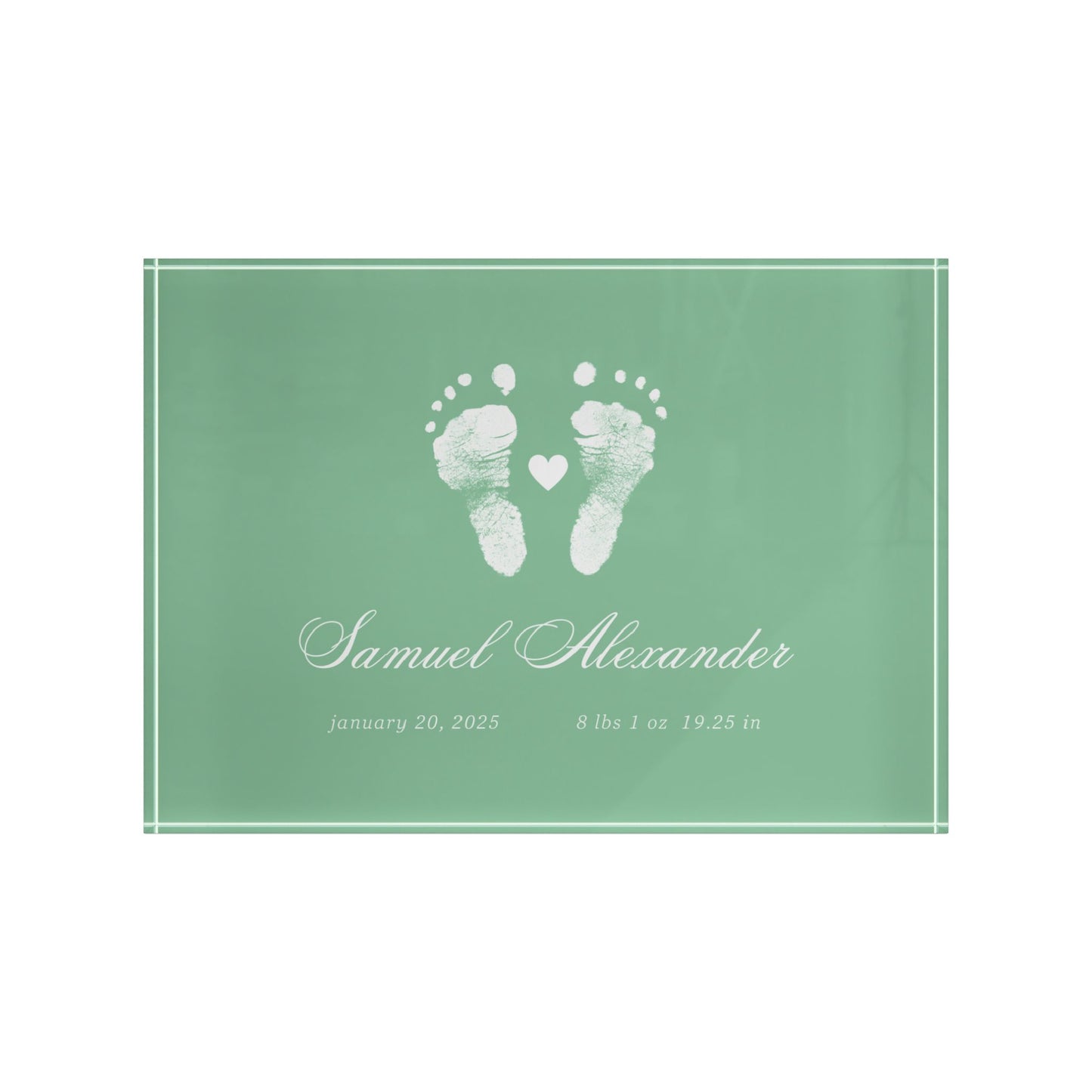 Green acrylic block with white baby footprints and text