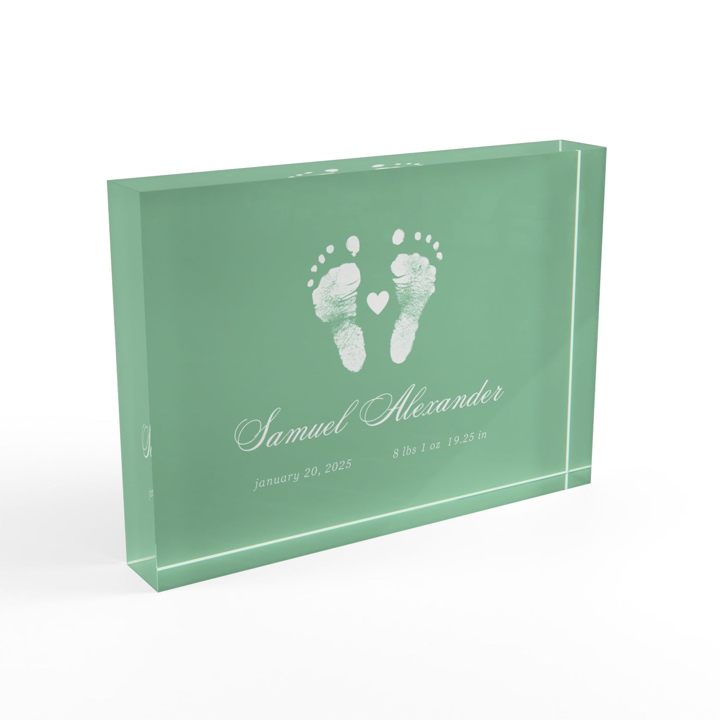 Green acrylic block with white baby footprints and text_2