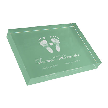 Green acrylic block with white baby footprints and text_3