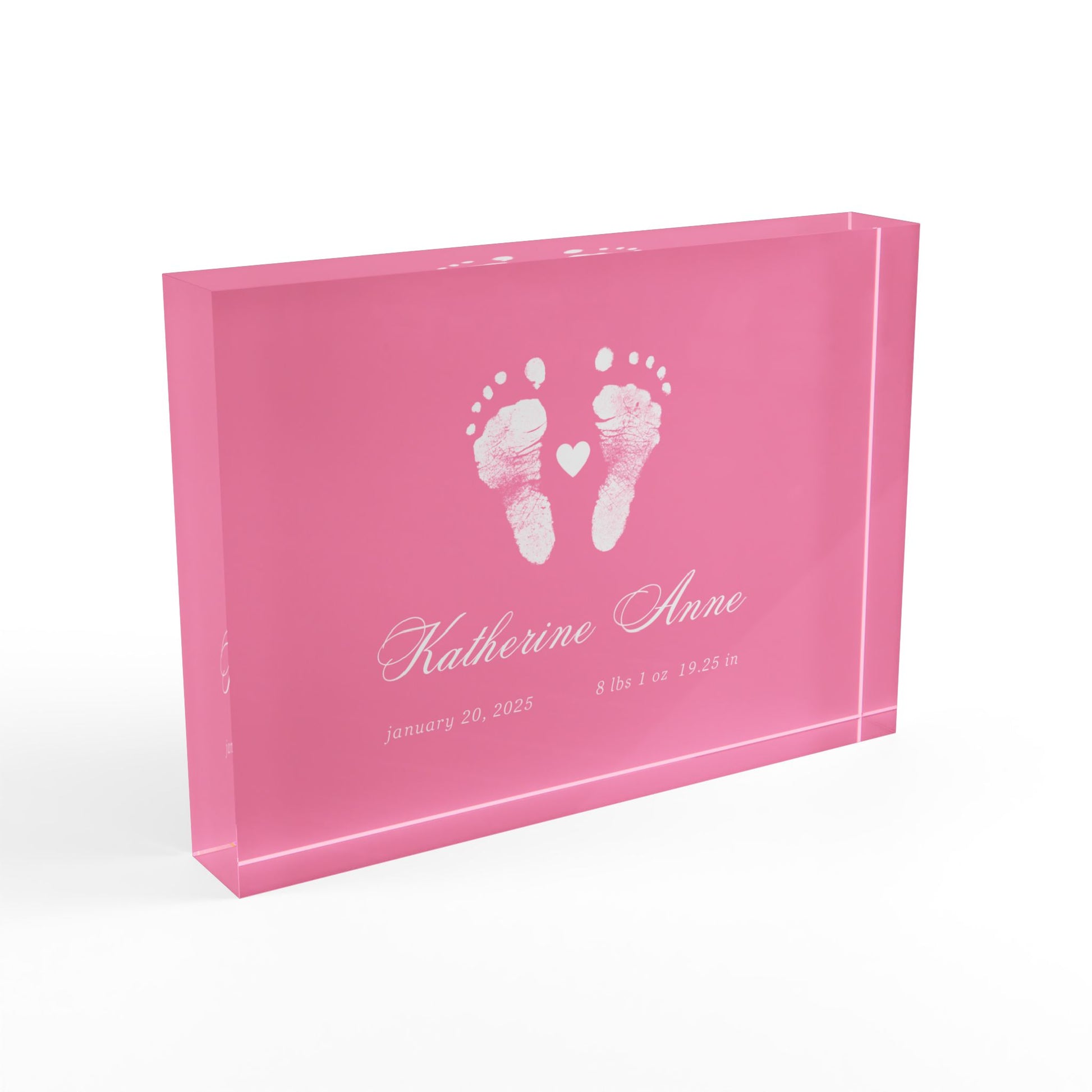 Pink acrylic block with white baby footprints and text_2