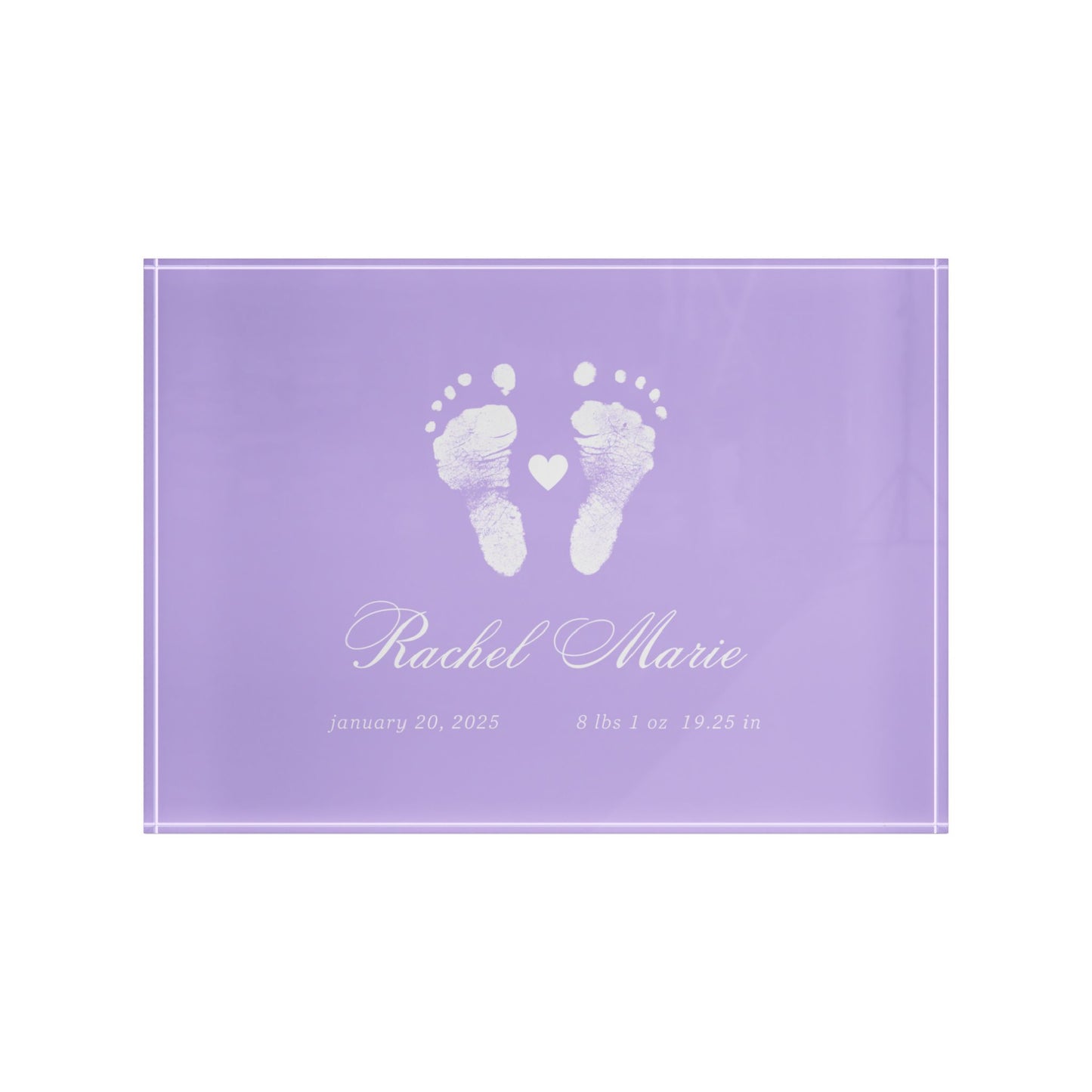 Purple acrylic block with white baby footprints and text.