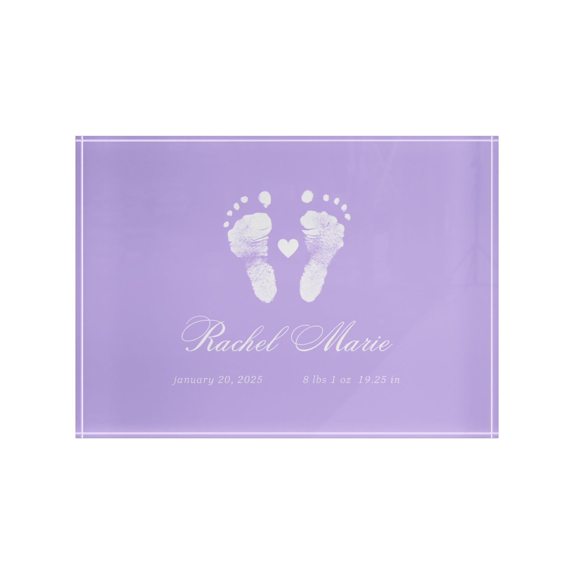 Purple acrylic block with white baby footprints and text.