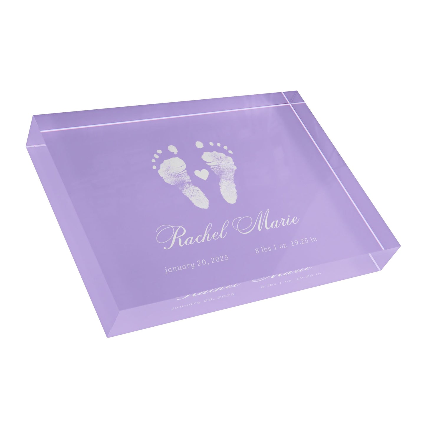 Purple acrylic block with white baby footprints and text._3