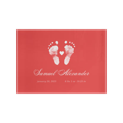 Red acrylic block with white baby footprints and text